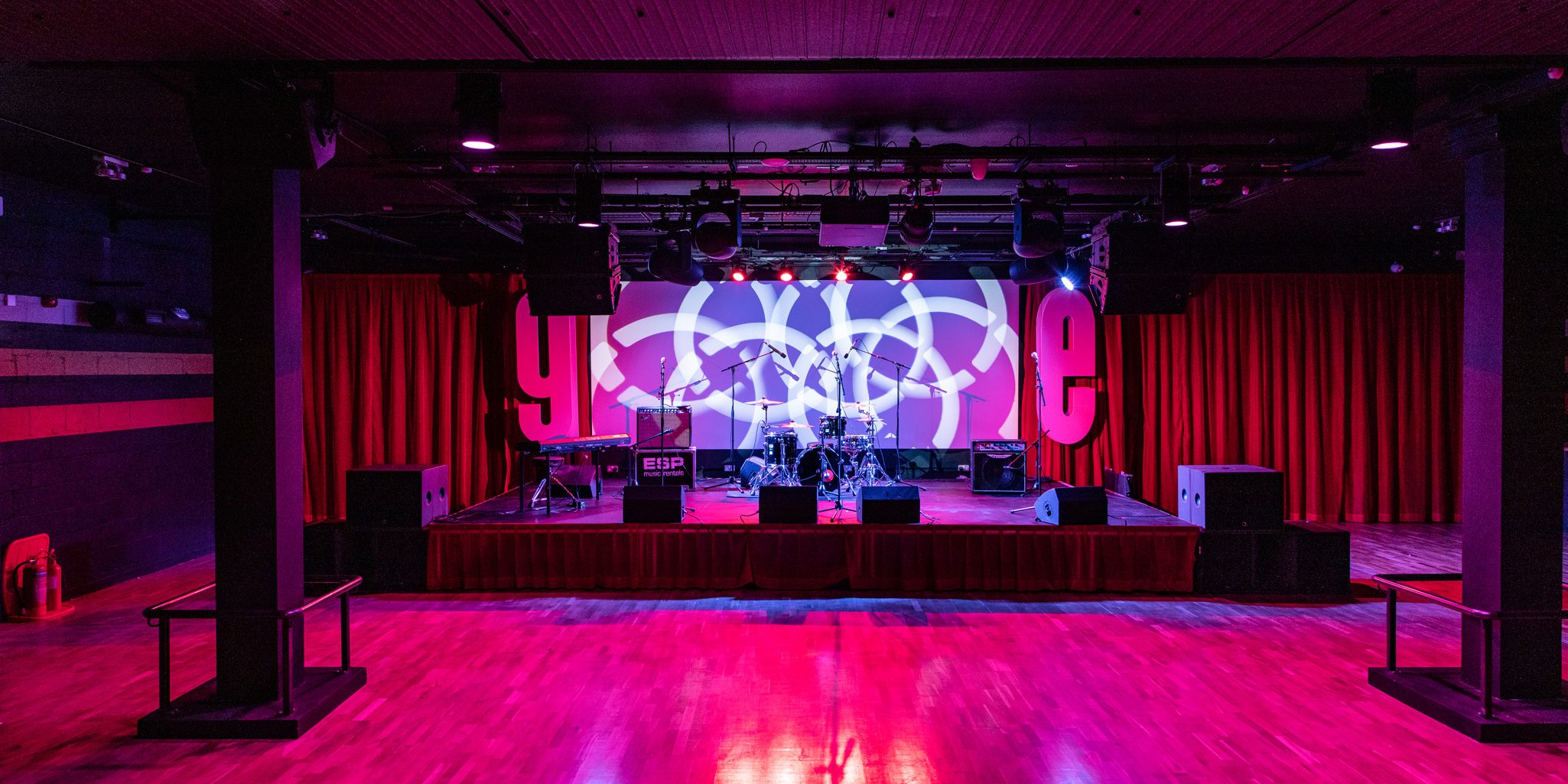 phot of venue with full band on stage